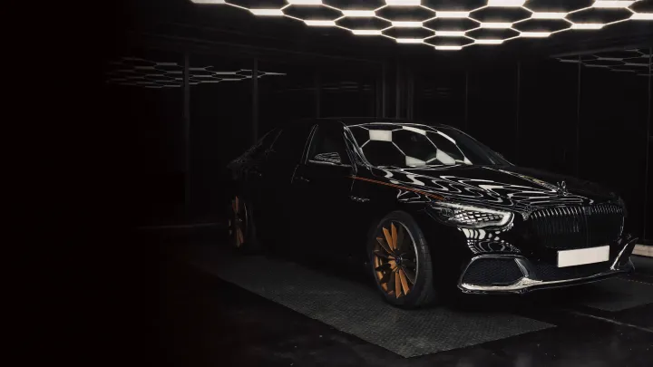 A freshly detailed car under studio lighting