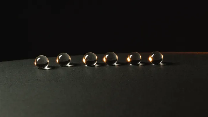 Water beading on a glossy ceramic-coated surface